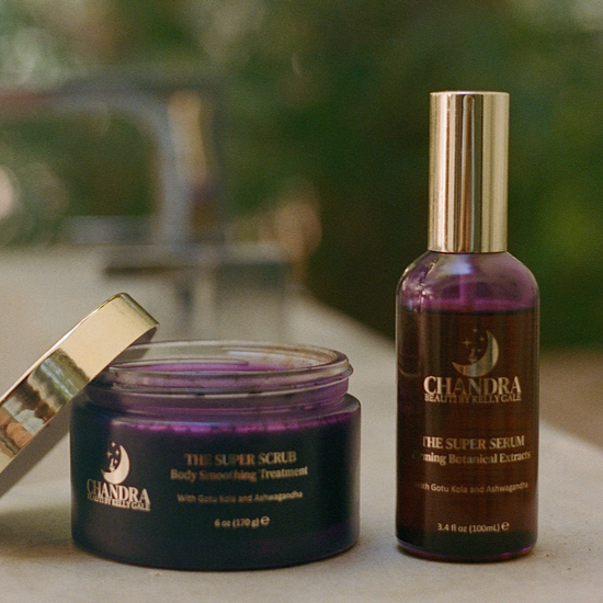 Jar of THE SUPER SCRUB next to bottle of THE SUPER SERUM