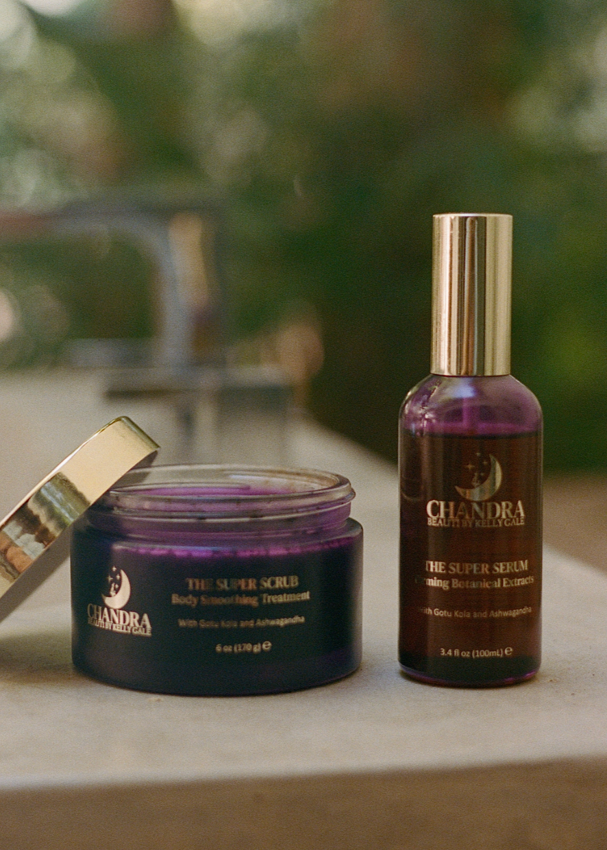 Jar of THE SUPER SCRUB next to bottle of THE SUPER SERUM