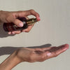 Squirting THE SUPER SERUM into palm